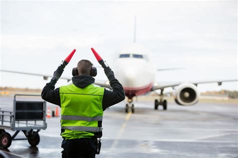 Air Traffic Controller Directing Aircraft